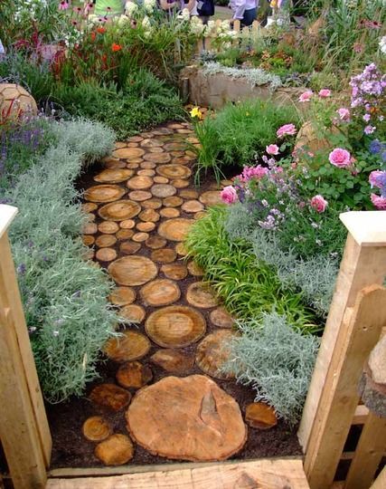 Reuse an old tree to make a log pathway.