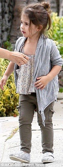 SMG's daughter Charlotte sports drainpipe cargo pants, a floral camisole top