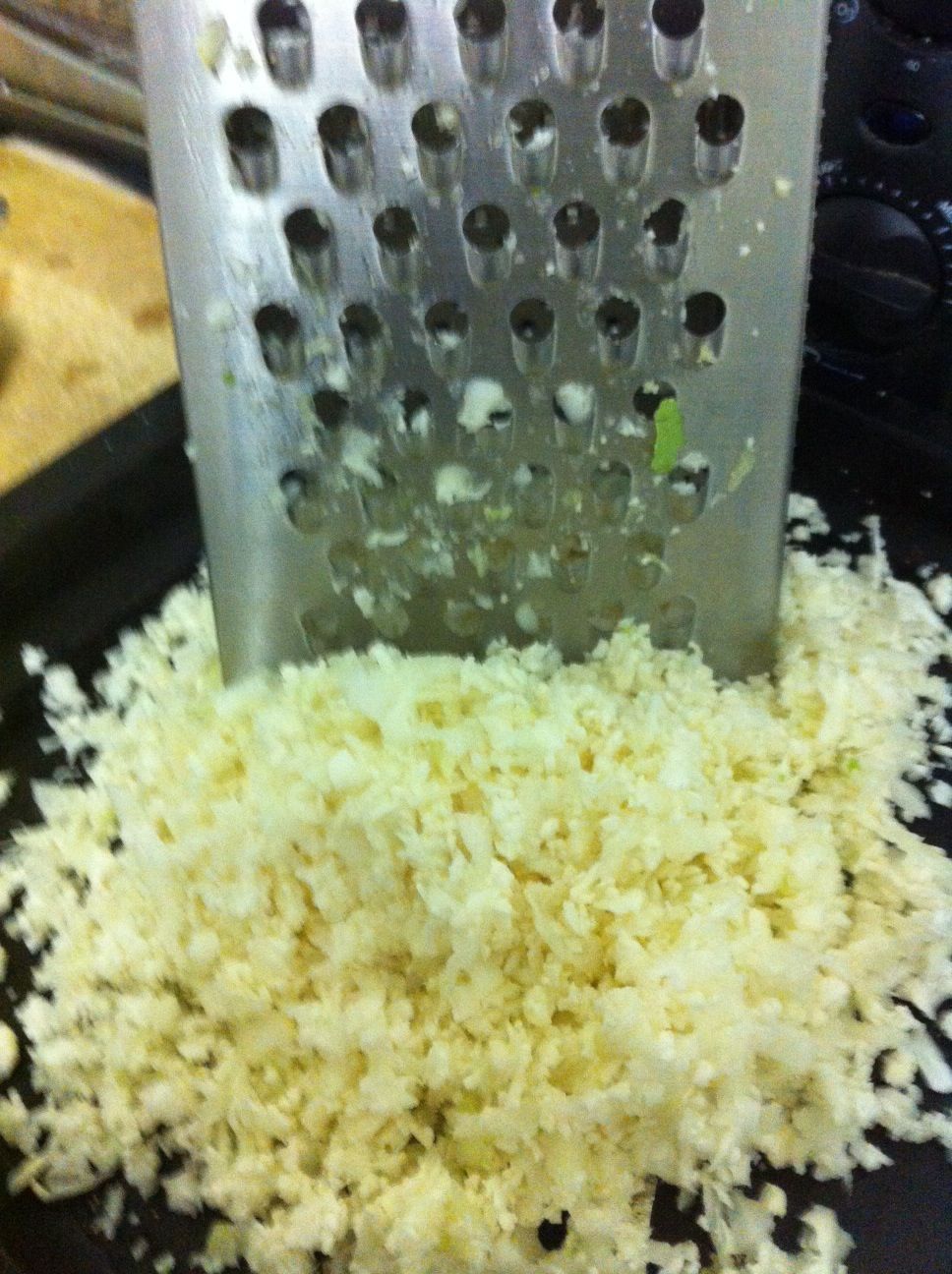 “Rice” the cauliflower by grating it with the widest hole in a chees