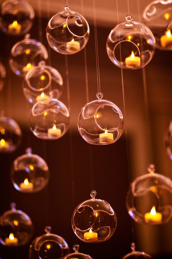 Glass Ornaments w/ Tealights. quite magical! Would look amazing hanging in trees