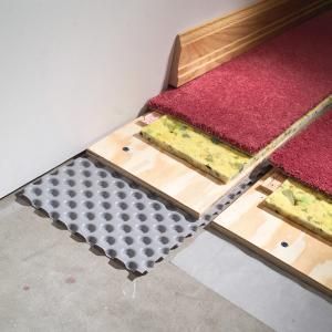Prevent damp basement floors from ruining carpet and other finished flooring. In