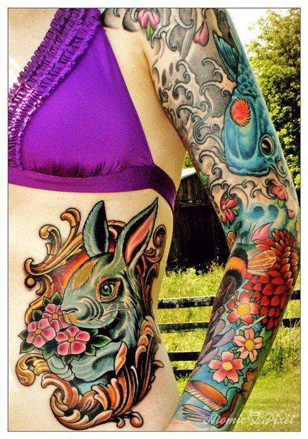 Rabbit tattoo, koi and flowers. Amazing colors. #tattoo #tattoos #ink