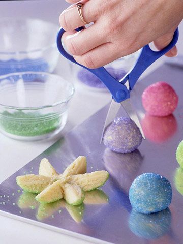 Roll a ball of sugar cookie dough in colored sugar. Snip it in half with scissor