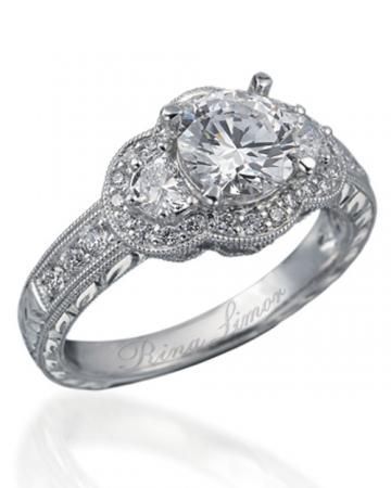 This Rina Limor engagement ring has an antique design and is set in platinum wit