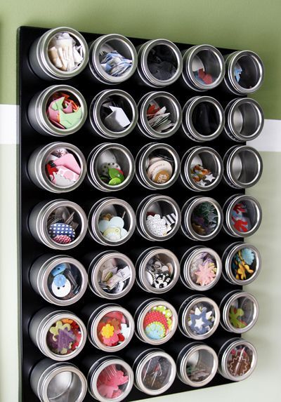 Use a magnetic board and favor tins to organize small things vertically.  This l