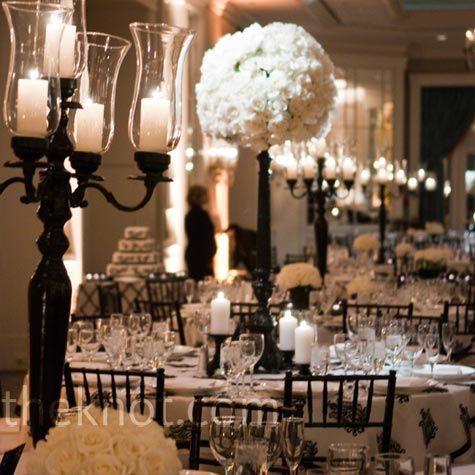 White Floral Centerpieces    All-white floral arrangements and black candelabras