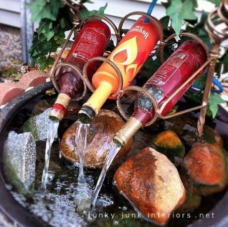 reuse wine bottles for a diy fountain :)