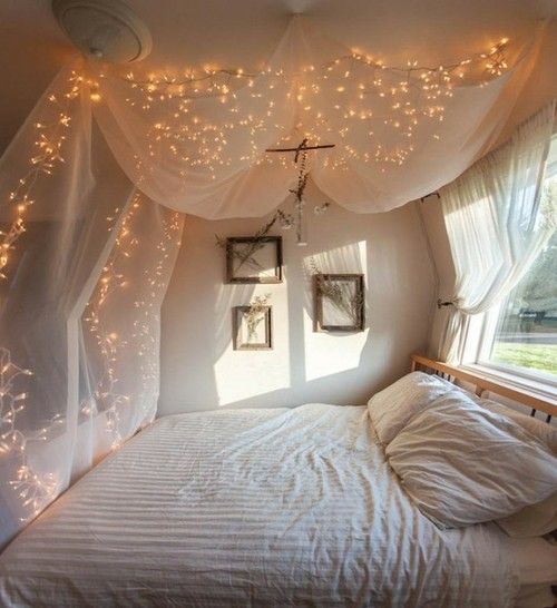 soft canopy bed + fairylights = cute. Perfect for little girls room.