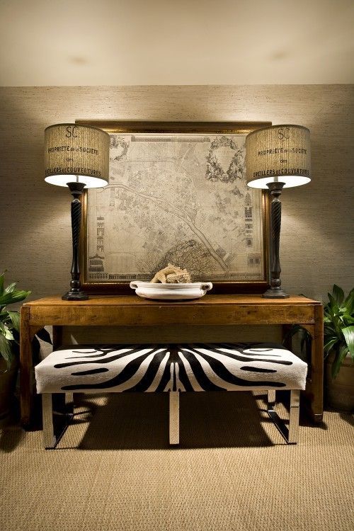 tall lamps with printed burlap shades, framed city map, zebra bench and modern c