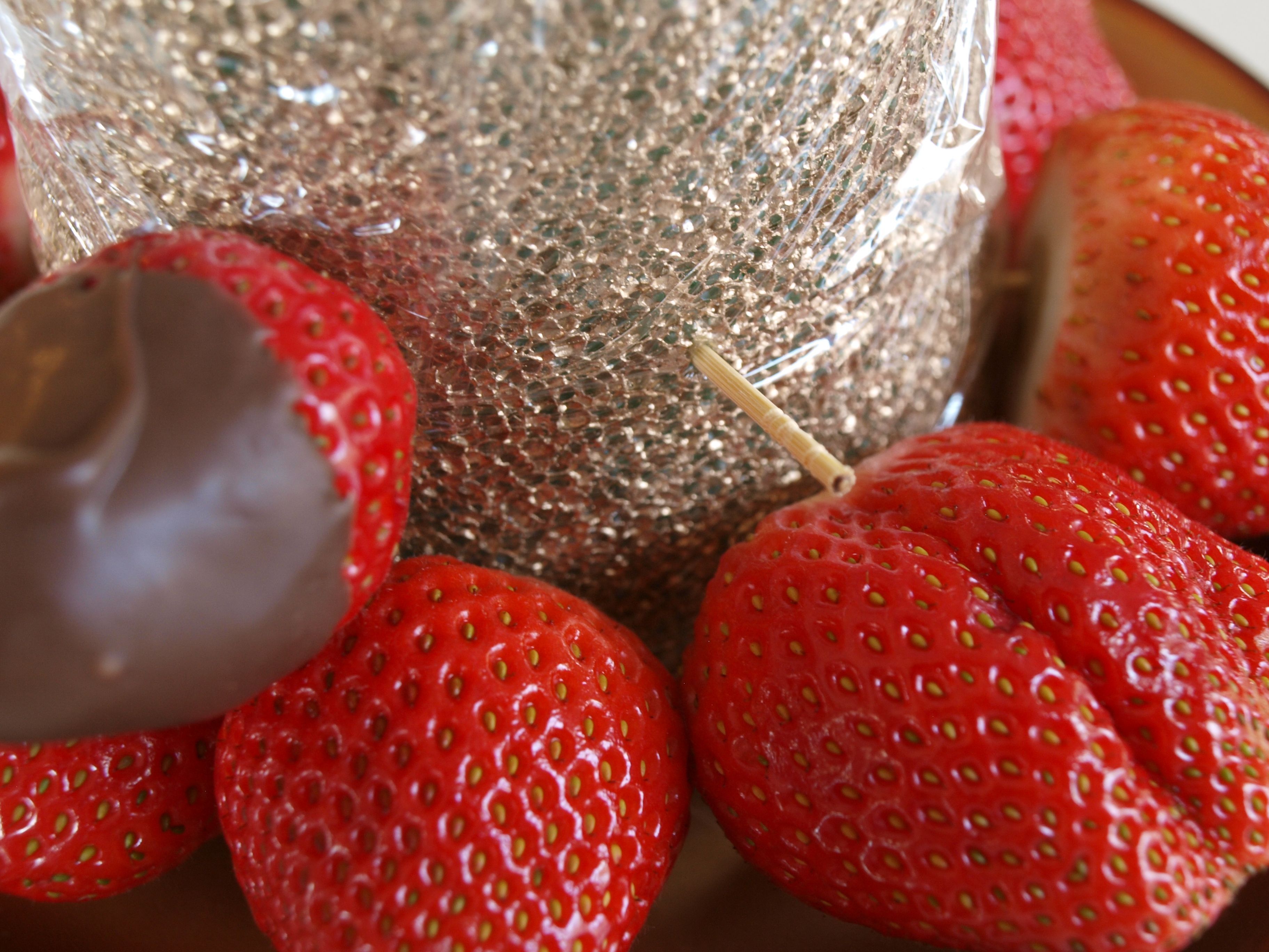 5. Place a row of strawberries on the cone -   How to Create a Chocolate Tree