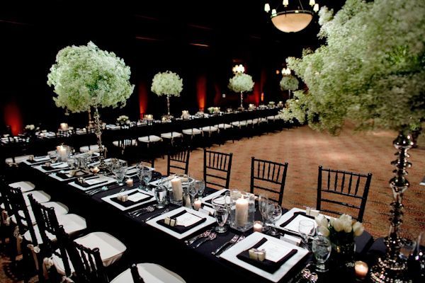 Black tablecloths with white candle wedding centerpiece decor, photo by John and