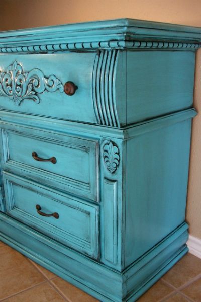 Dresser with molding and detailed scroll work, painted Turquoise and with Black