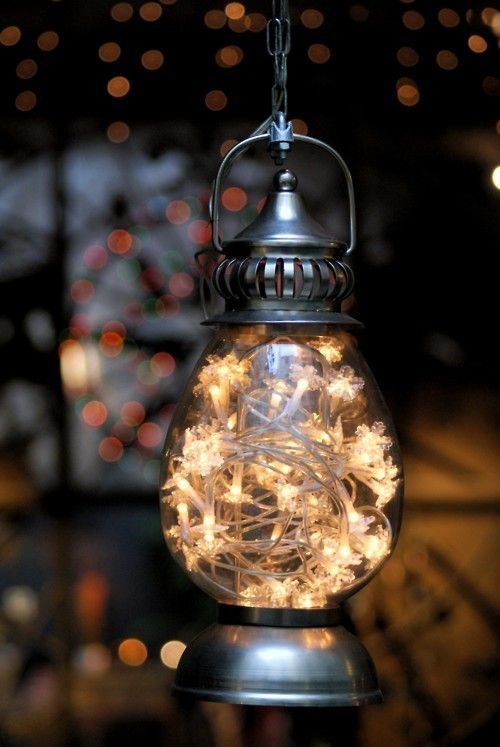 Fill any inexpensive lantern with a string of white lights and hang around your