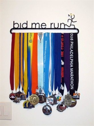 From a Runner's World forum, a custom made medal display.  Great quote (from