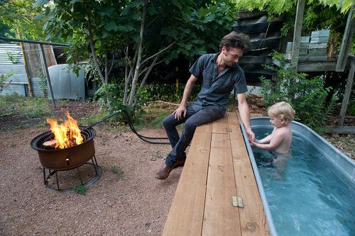 I want my own DIY hot tub!!….Jesse Hartman (L) has created a backyard space th