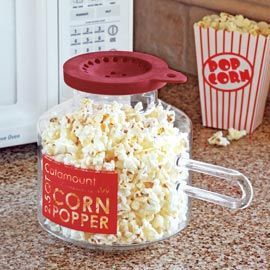I want one! Glass Microwave Corn Popper. You can add butter to the lid so it mel