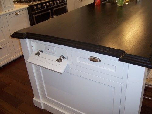 Kitchen island with outlets disguised as drawers