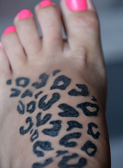 Leopard foot tattoo.