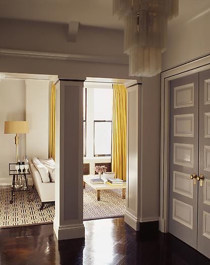 Love these grey walls + yellow curtains; a good look in the library
