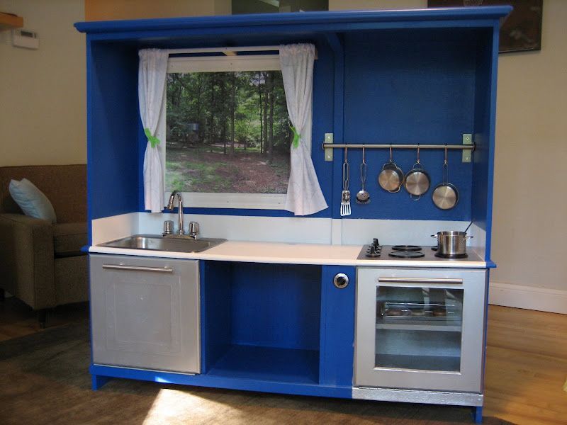 OK, it's an adorable PLAY kitchen, upcycled from an old entertainment center