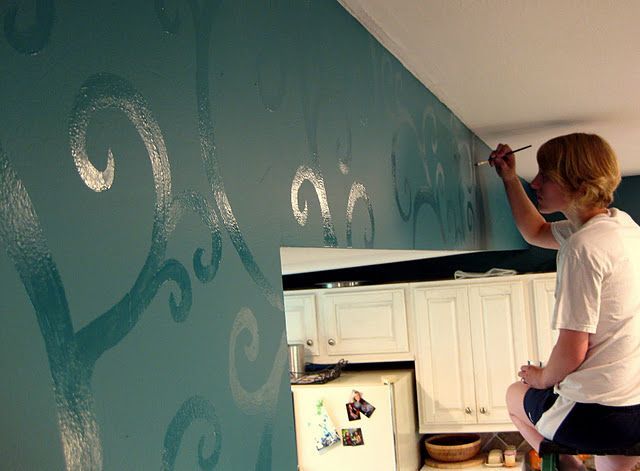 Paint the wall in flat color then use the same color but in high gloss for the d