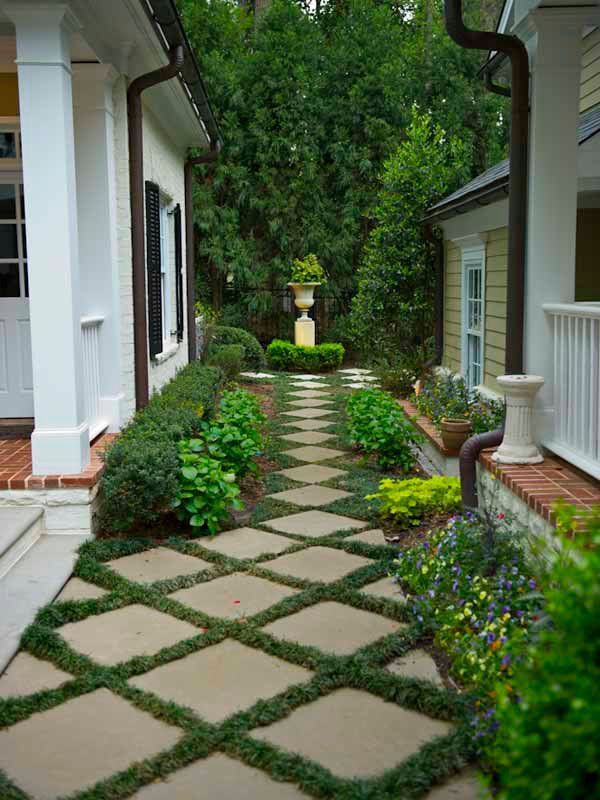 Pavers spaced with grass or groundcover create an attractive garden path. Author
