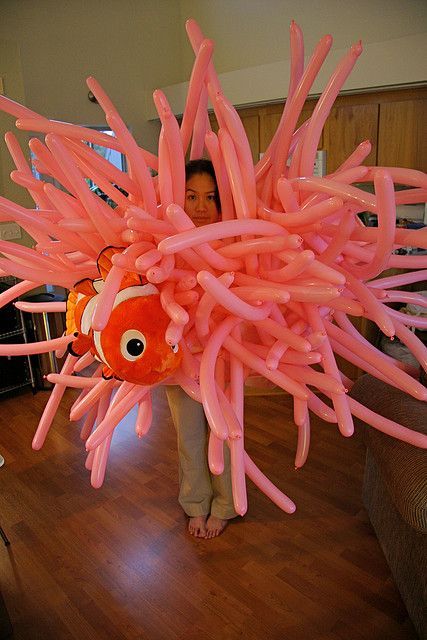 Sea Anemone costume.  Balloons and stuffed Nemo toy. So awesome in its simplicit