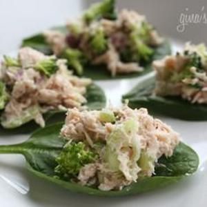 Spoon lean tuna salad onto spinach leaves as finger food or a light lunch.