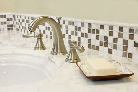 Thin strip of glass tile as a bathroom vanity backsplash.