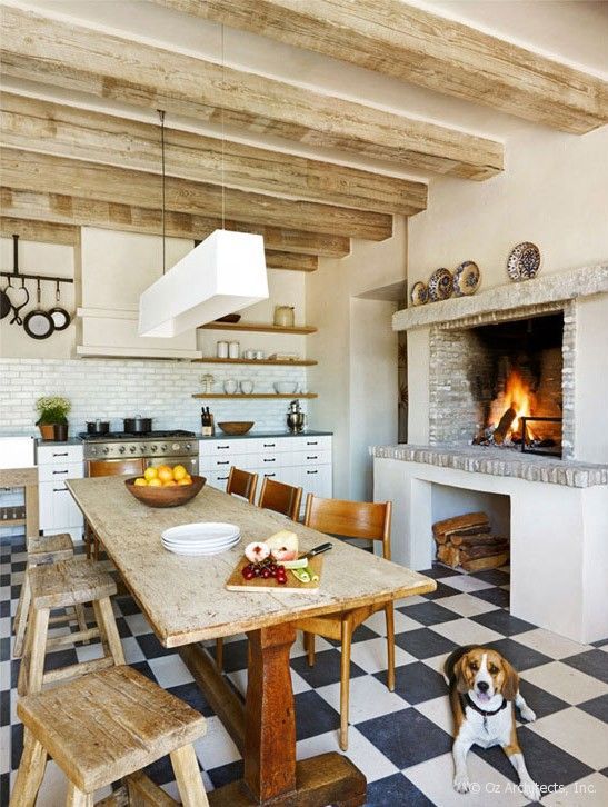 blue & white checkered floor, fireplace in kitchen, dining table in kitchen,
