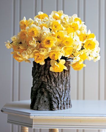 drill a hole in a log, add a glass jar and you have a beautiful natural vase.
