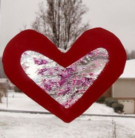 “stain glass” heart made from crayons and plastic wrap