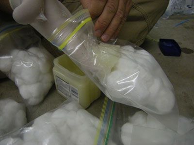 vaseline and cotton balls. costs around $4.50 to make about 600 hundred of these