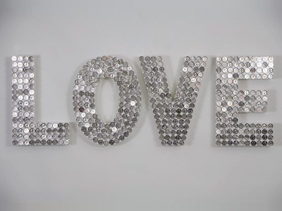 wooden letters covered in coins or glass beads. Would be awesome with pennies.
