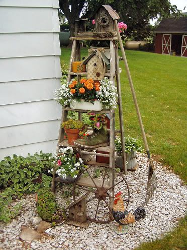 A rustic vertical ladder garden stacked with treasures. | The Micro Gardener
