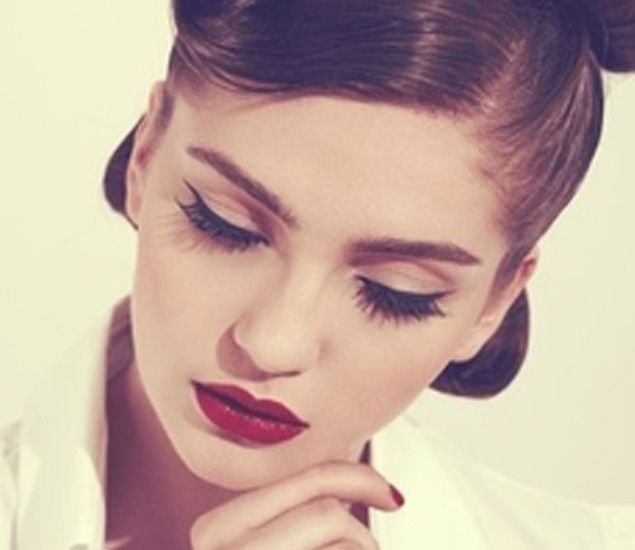 Bold red lips and simple eye line = Fierce and sultry.
