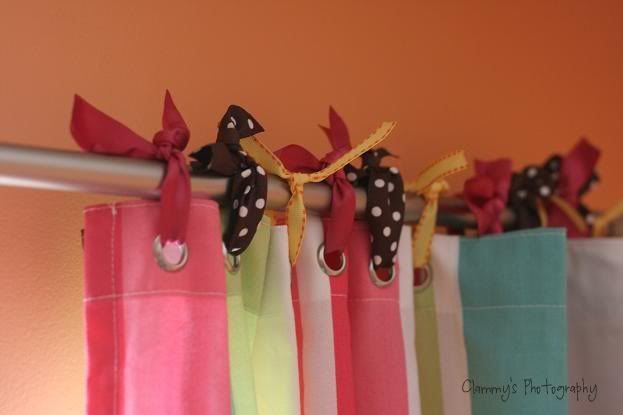 Cute window treatment……a shower curtain and ribbon – try multi color ribbon