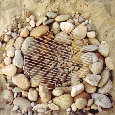 Going to the shore for the long weekend? Build a beach grill from rocks and sand