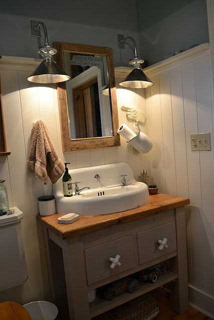 I love this farmhouse bathroom. The pitcher paper towel holder is a great idea,
