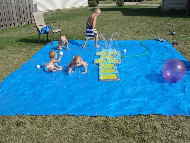 14. But actually, this DIY splash pad made from a tarp is even cheaper. -   32 Cheap And Easy Backyard Ideas