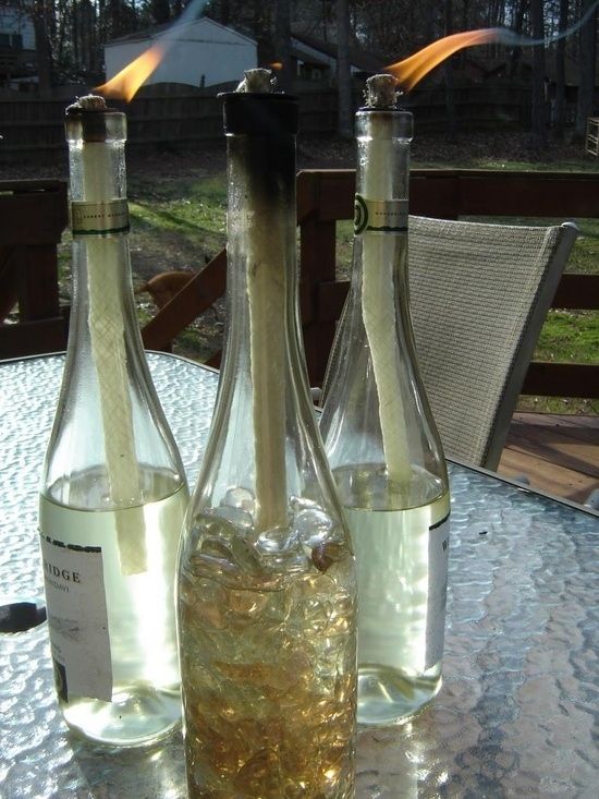15. Reuse your empty wine bottles by making mosquito-combating tiki torches with them. -   32 Cheap And Easy Backyard Ideas