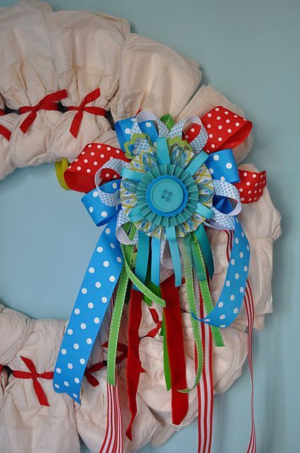 diaper wreath…fun baby shower idea!  a nice alternative from the typical diape