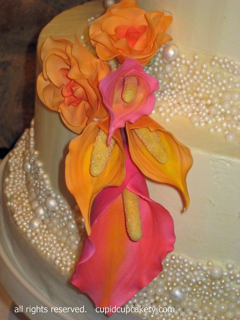 pearl wedding cake with pink and orange