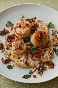 seared scallops over roasted cauliflower disks with shallots, capers, sun dried