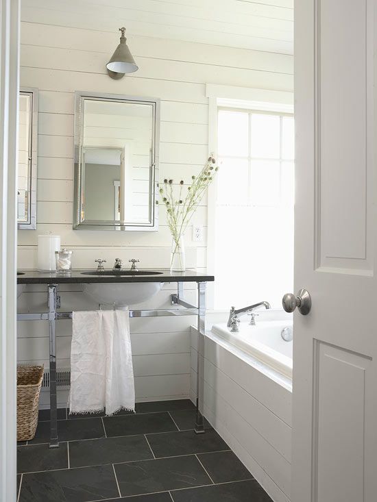 source: BHG      Sleek bathroom with slate floor, white horizontal plank board w