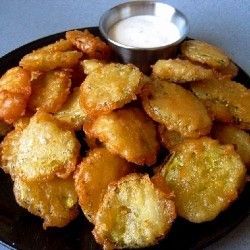 Fried Pickles!!! Dill Pickle Chips drained, 3/4 to 1 cup of beer, 2 eggs, 1 -2 c