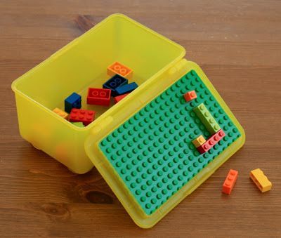 Use an old Baby Wipes container, hot glue or super glue a large Lego piece to th