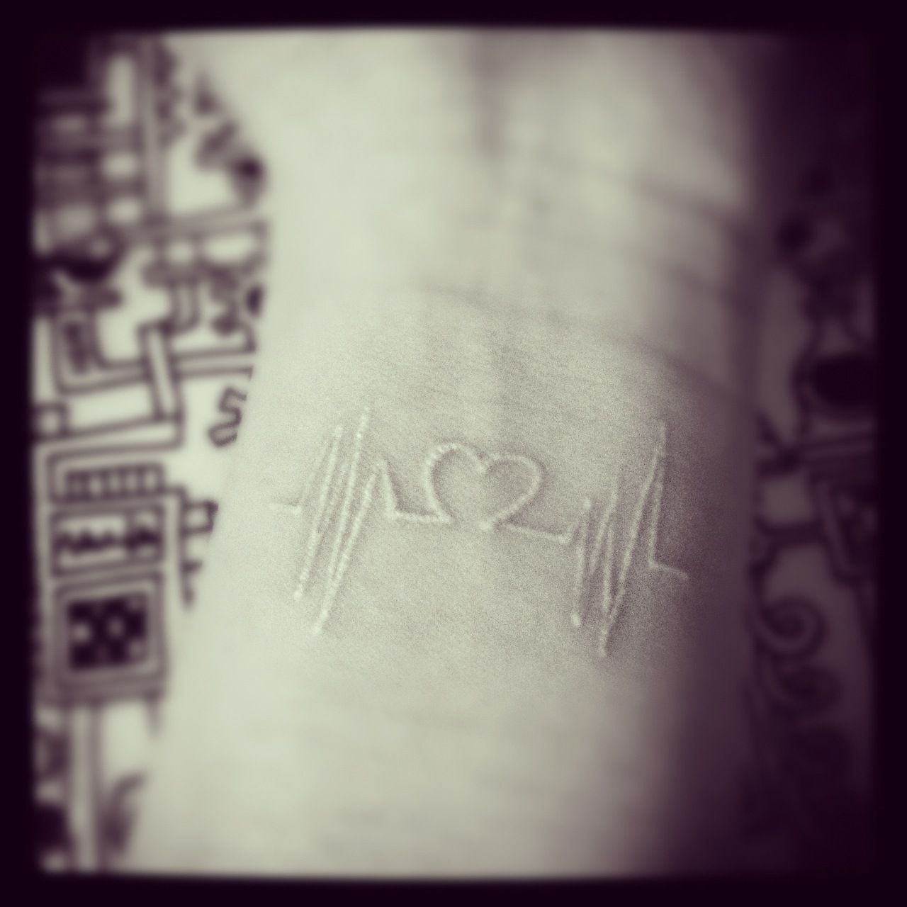 White ink heartbeat tattoo. There is a website that can change words into a soun