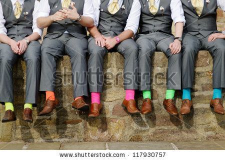 Funny colorful socks of groomsmen – stock photo