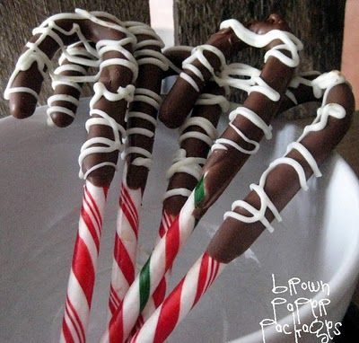 chocolate dipped candy canes to stir some hot cocoa! Yummy!! Thanks @Aimée Gill
